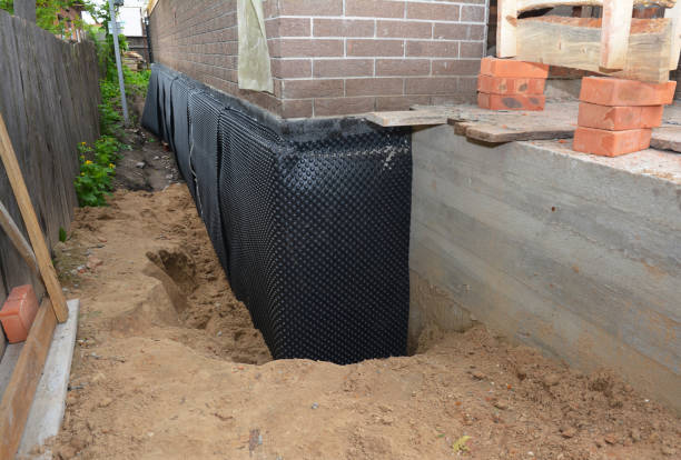 Happy homeowners after waterproofing job in Madisonville